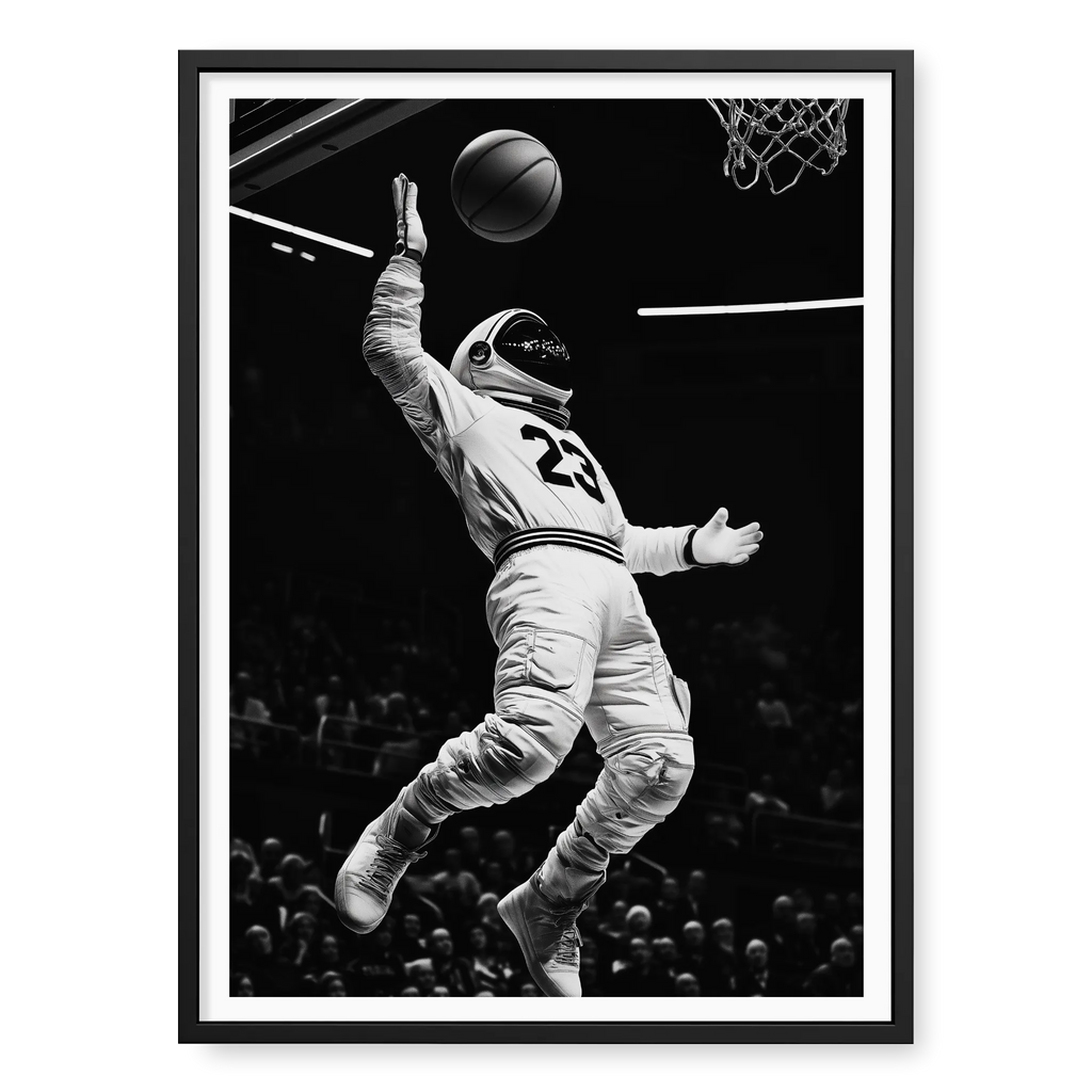 Low-angle action shot of an astronaut in a space suit and jersey number 23 performing a basketball dunk in a stadium, black and white art print titled Twenty Three in black frame