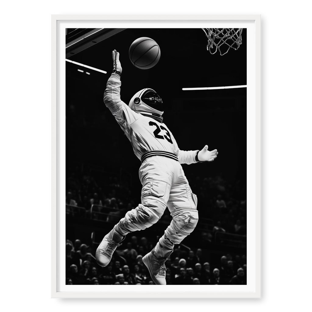 Low-angle action shot of an astronaut in a space suit and jersey number 23 performing a basketball dunk in a stadium, black and white art print titled Twenty Three in white frame