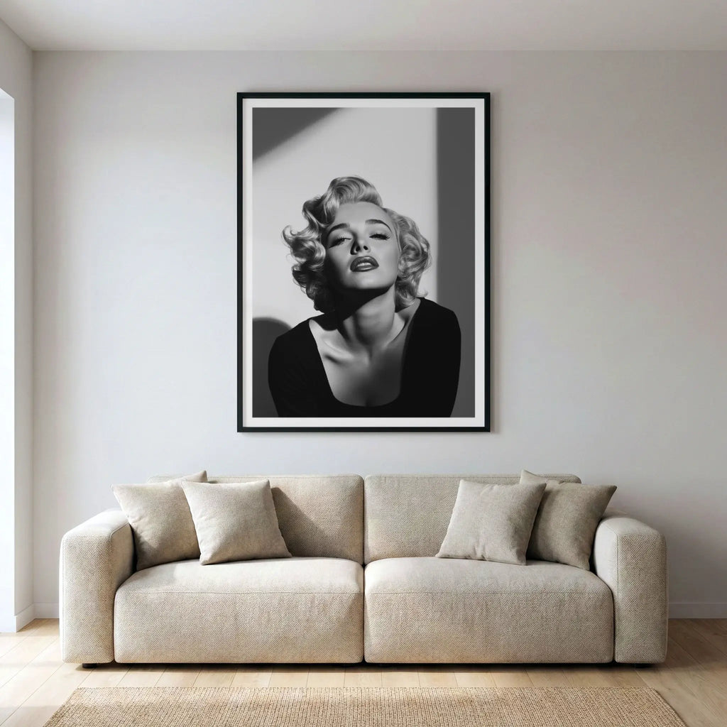 Framed black and white art print of Marilyn Monroe, titled Blonde Bombshell displayed in living room