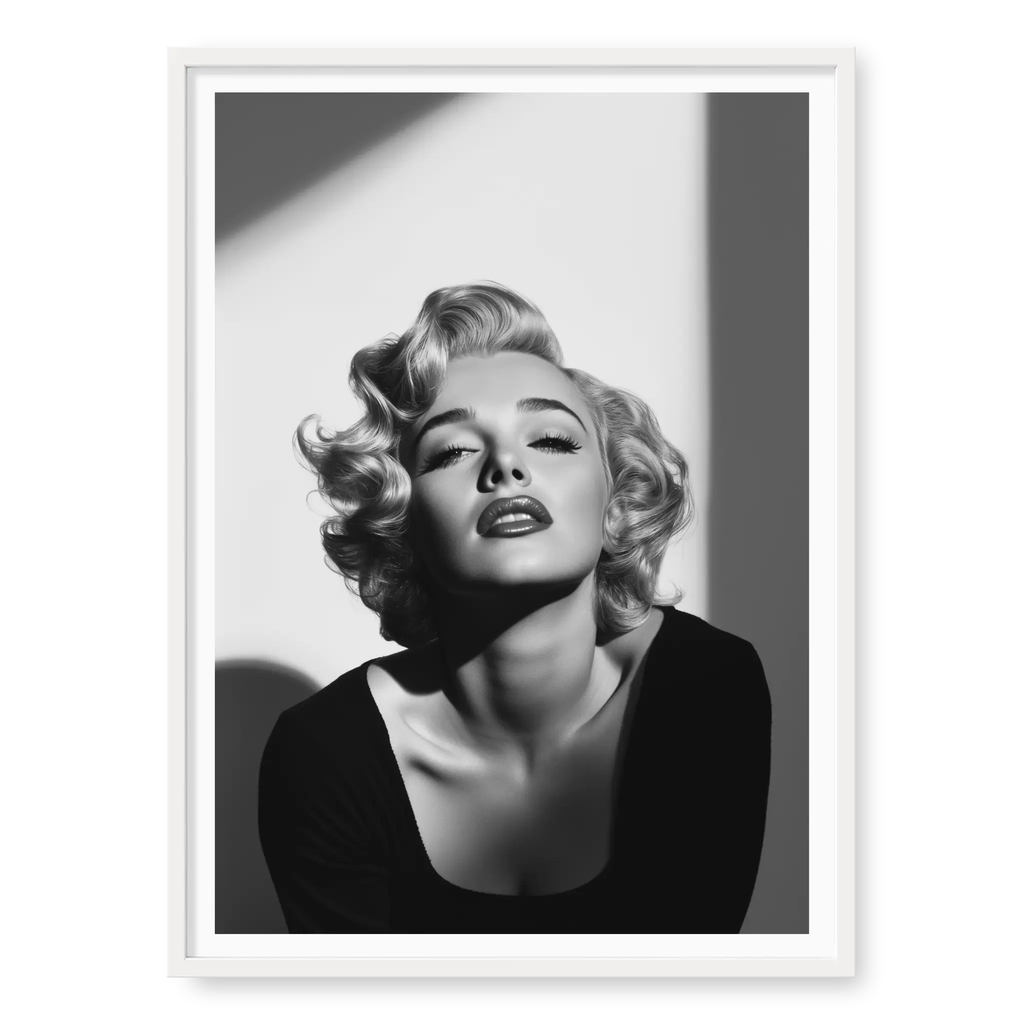 Close-up of Marilyn Monroe with short curly hair and dark lipstick looking up into light, black and white art print titled Blonde Bombshell in white frame
