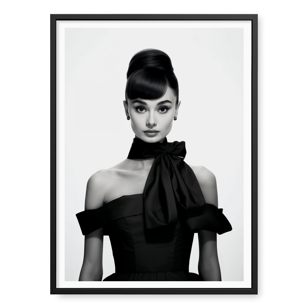 Portrait of Audrey Hepburn with high bun and black bow dress, black and white art print titled Breakfast at Tiffany's in black frame