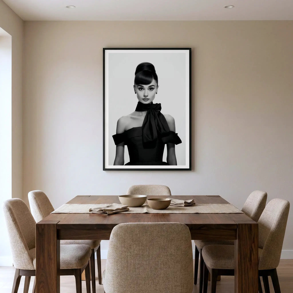Framed black and white art print of Audrey Hepburn in black dress, titled Breakfast at Tiffany's displayed in dining room
