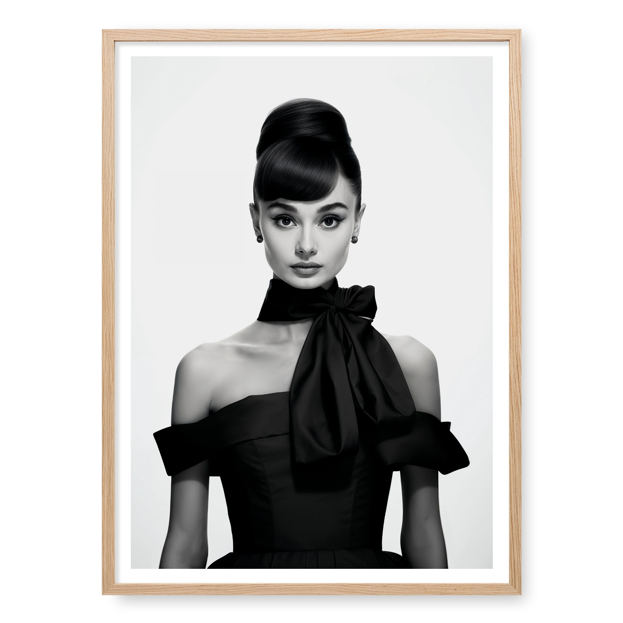 Portrait of Audrey Hepburn with high bun and black bow dress, black and white art print titled Breakfast at Tiffany's in natural oak frame