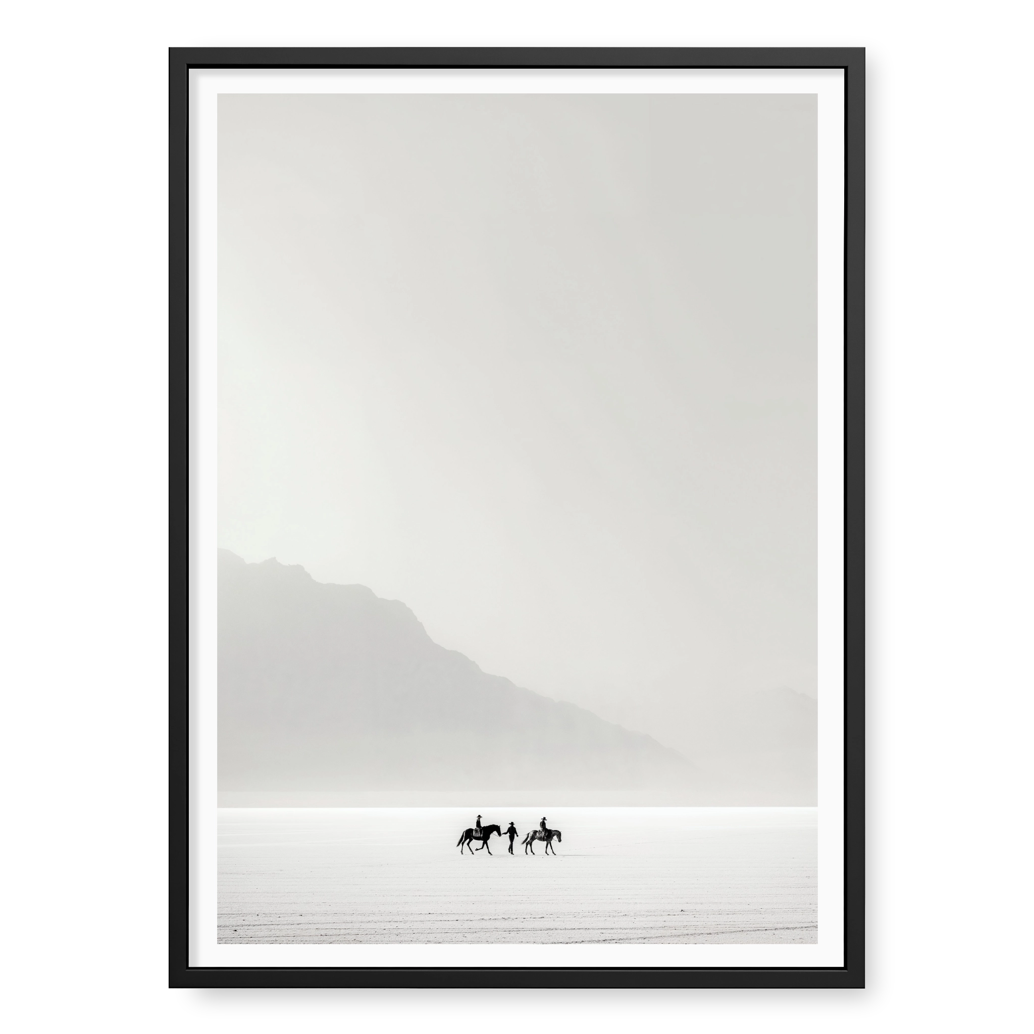 Tiny silhouettes of riders on horseback journeying across a vast white desert landscape, art print titled Destination Unknown in black frame