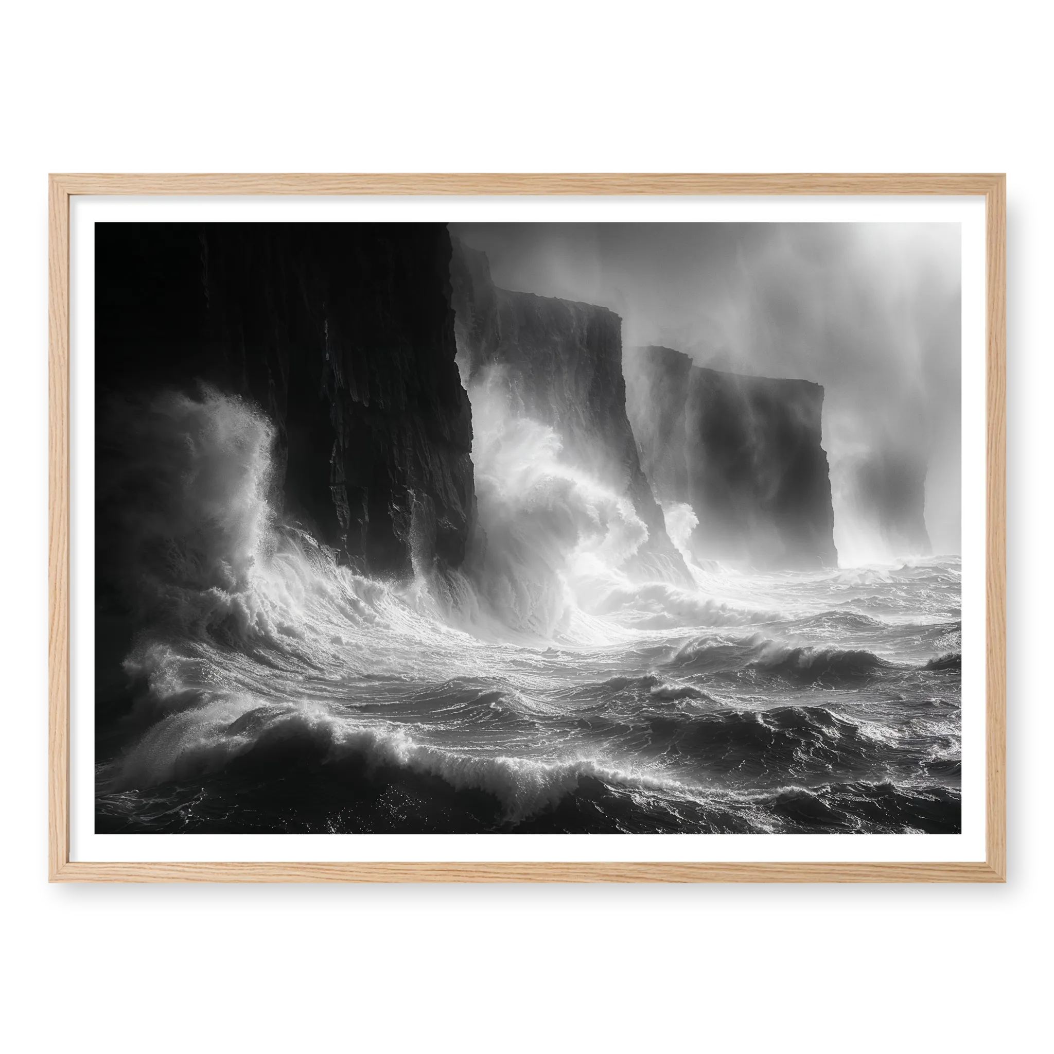 Massive storm waves crashing violently against dark sheer cliffs with mist rising, black and white art print titled Gates of Hell in natural oak frame