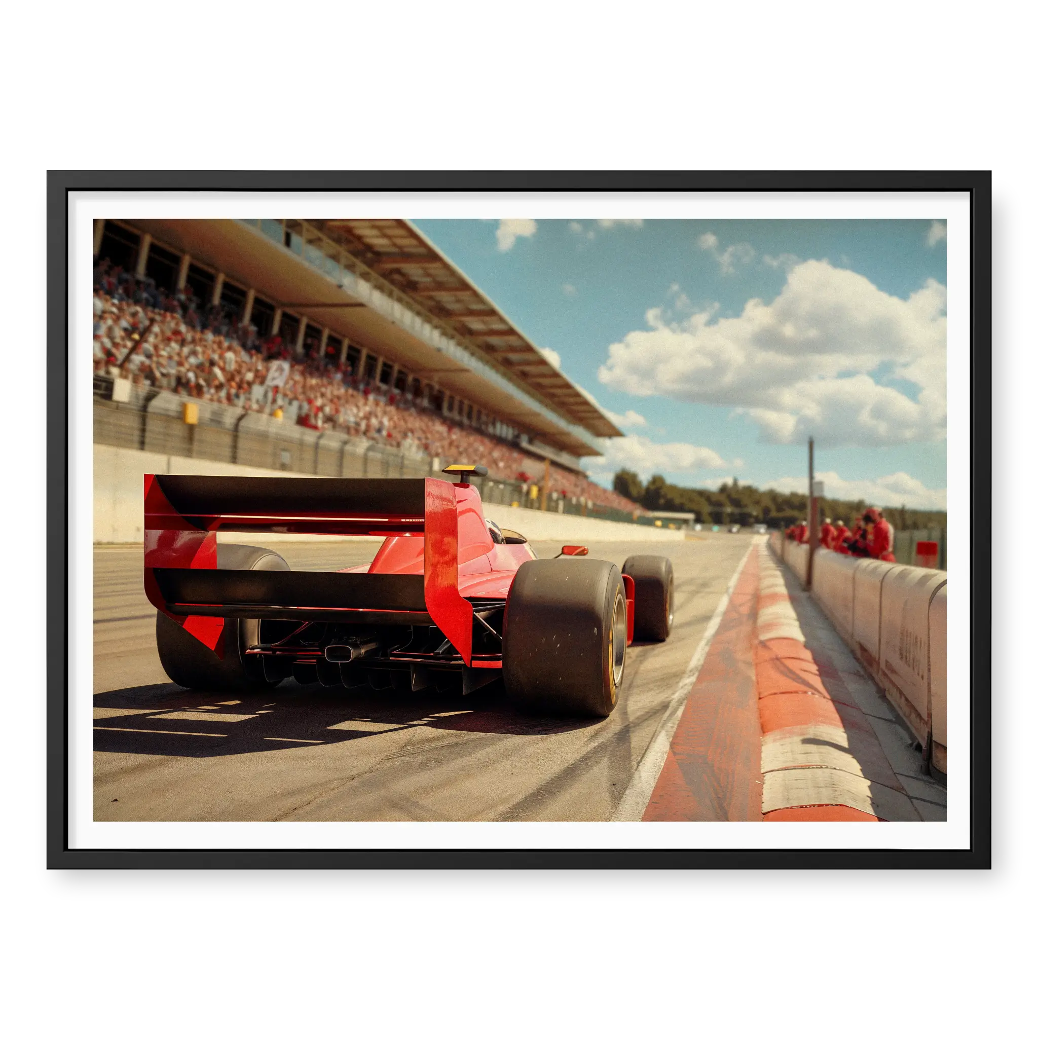 Low angle rear view of a vintage red F1 race car driving on a track with grandstands in the background, art print titled Glory Days in black frame