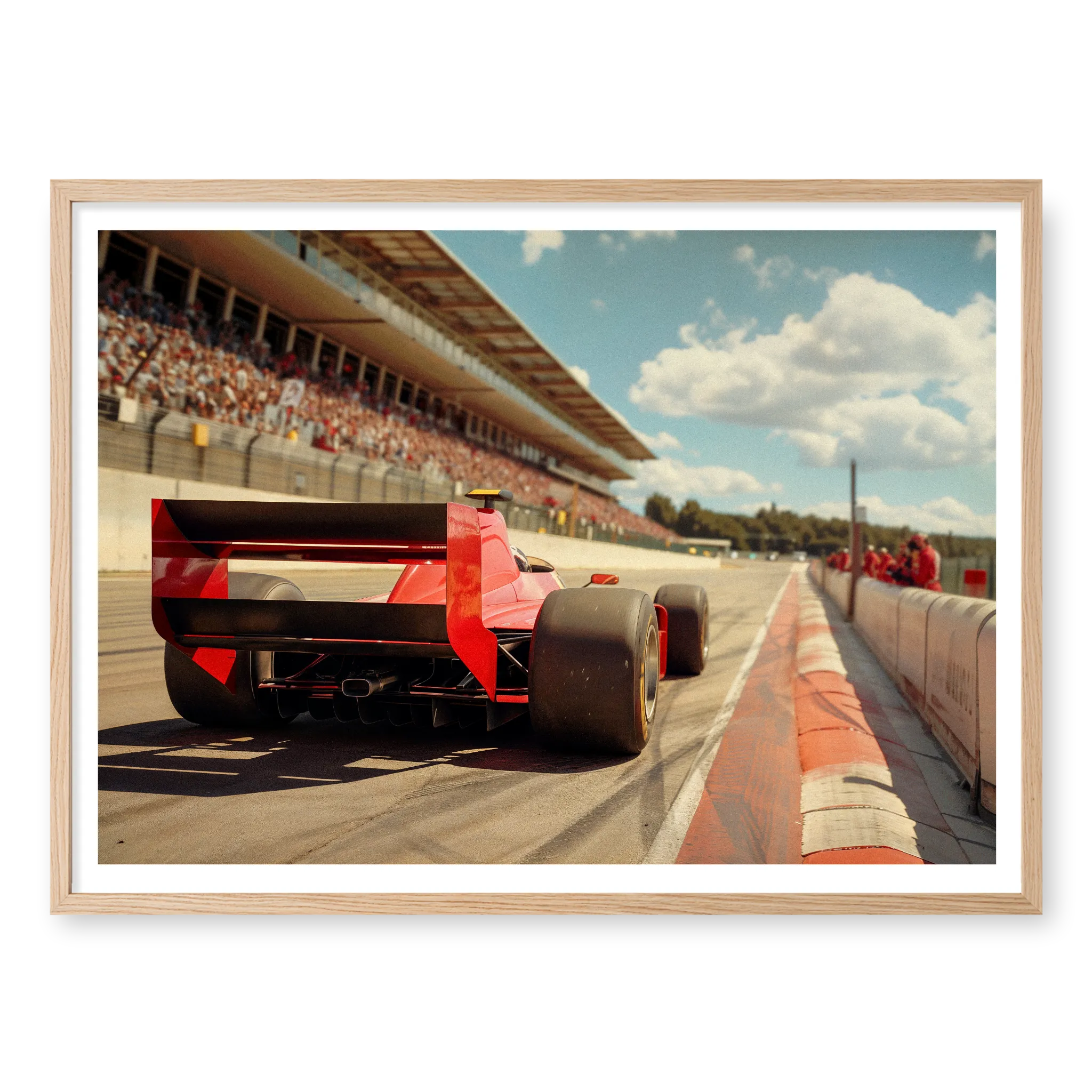 Low angle rear view of a vintage red F1 race car driving on a track with grandstands in the background, art print titled Glory Days in natural oak frame