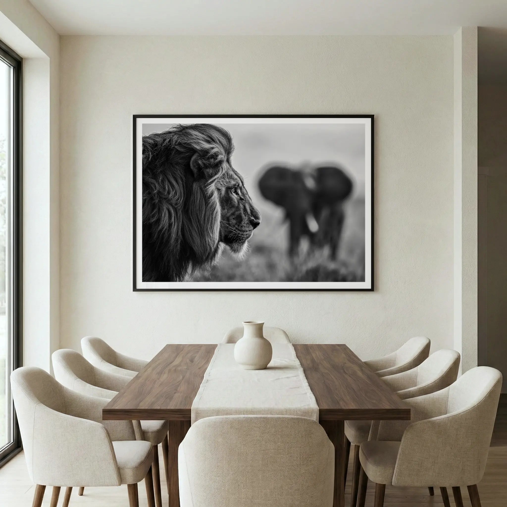 Framed black and white art print with lion profile and elephant background, titled Intellectus displayed in dining room