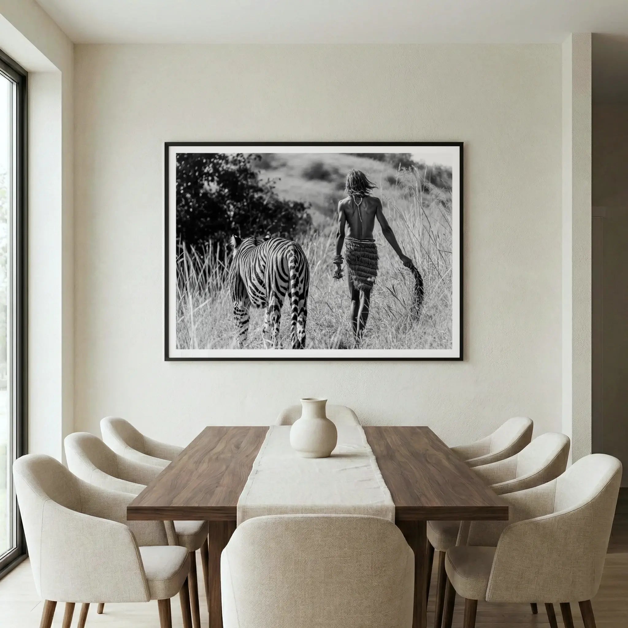 Framed surreal art print with man and tiger walking away together, titled Life of Pi displayed in dining room