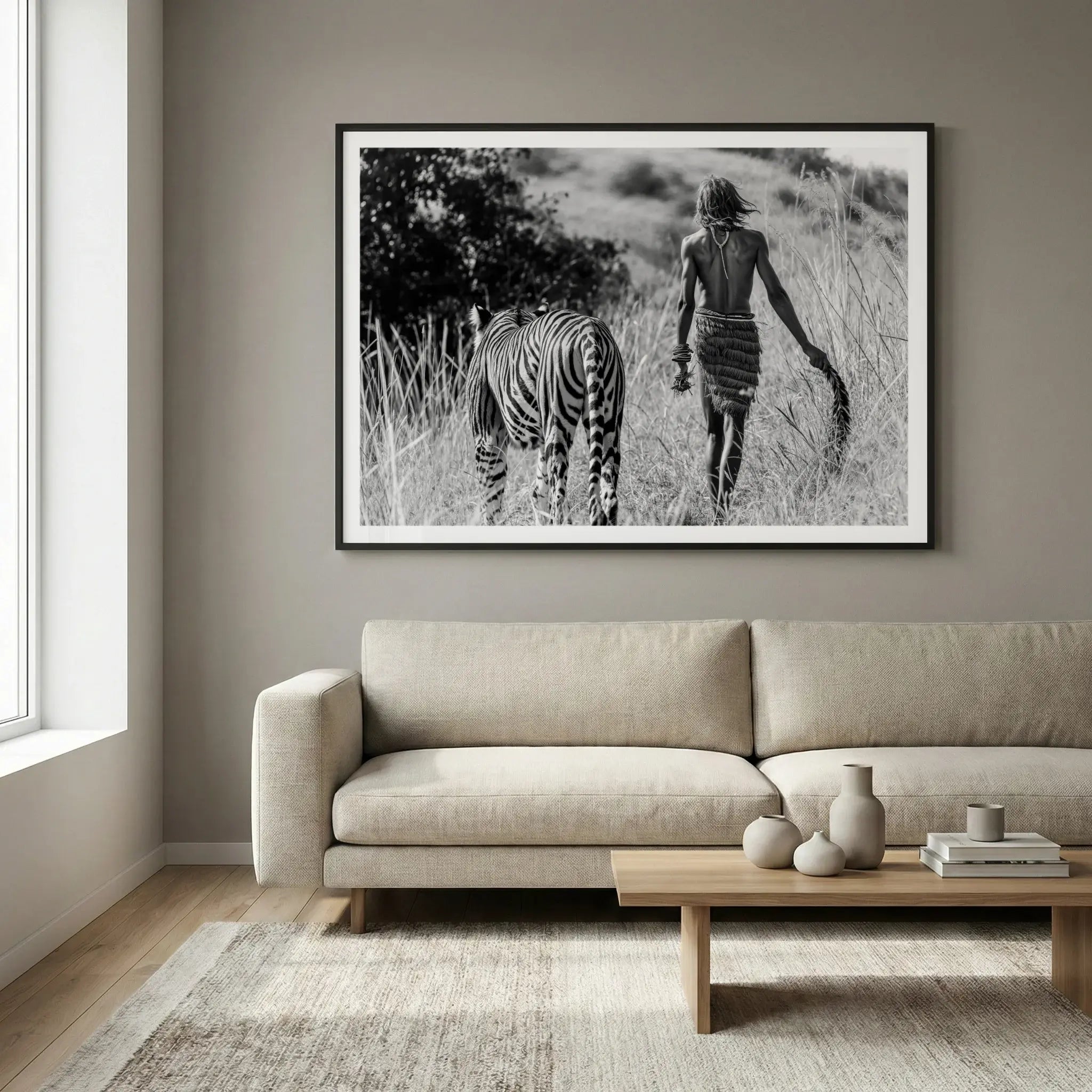Framed surreal art print with man and tiger walking away together, titled Life of Pi displayed in living room