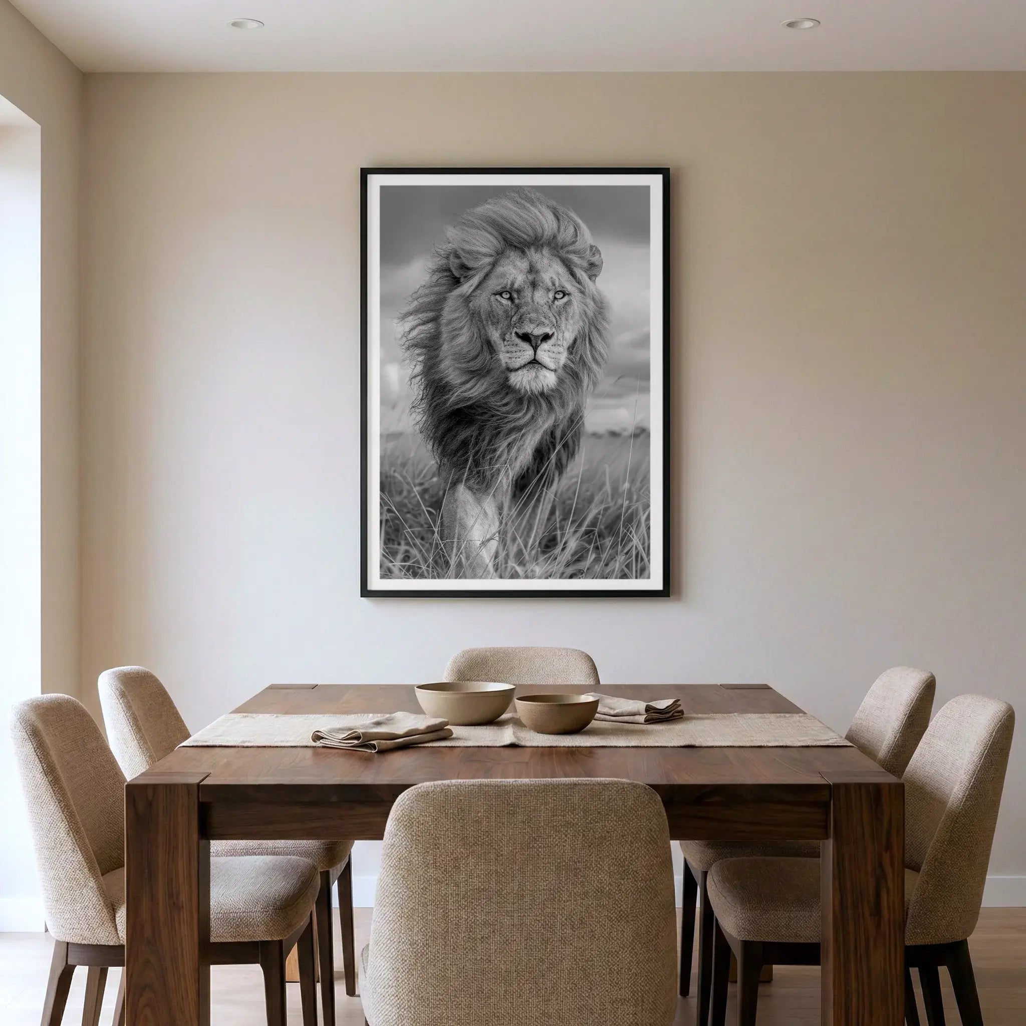 Framed black and white lion art print, titled Majesty displayed in dining room