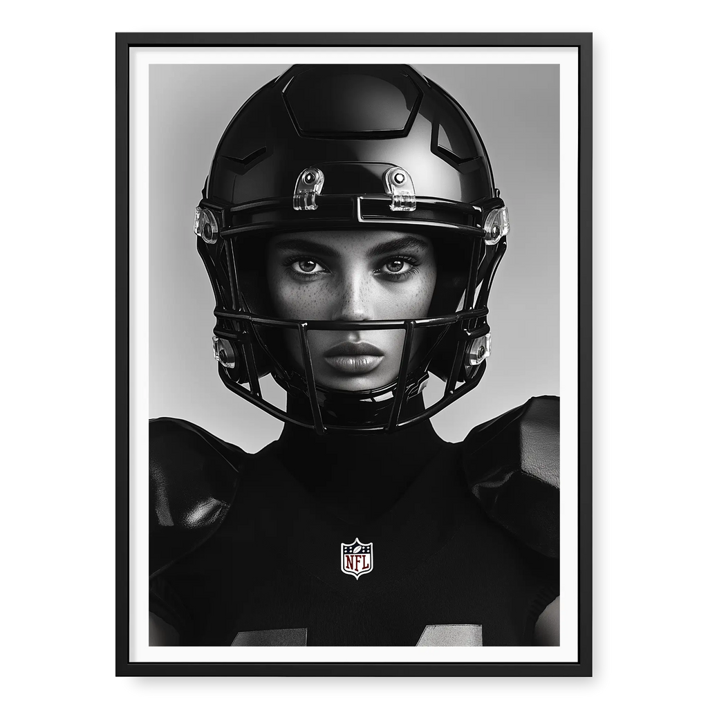 Close-up front-facing portrait of a female American football player wearing a glossy black helmet and pads with the NFL logo, black and white art print titled Modern Gladiator in black frame