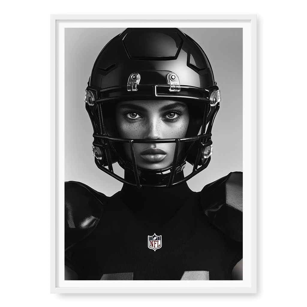 Close-up front-facing portrait of a female American football player wearing a glossy black helmet and pads with the NFL logo, black and white art print titled Modern Gladiator in white frame