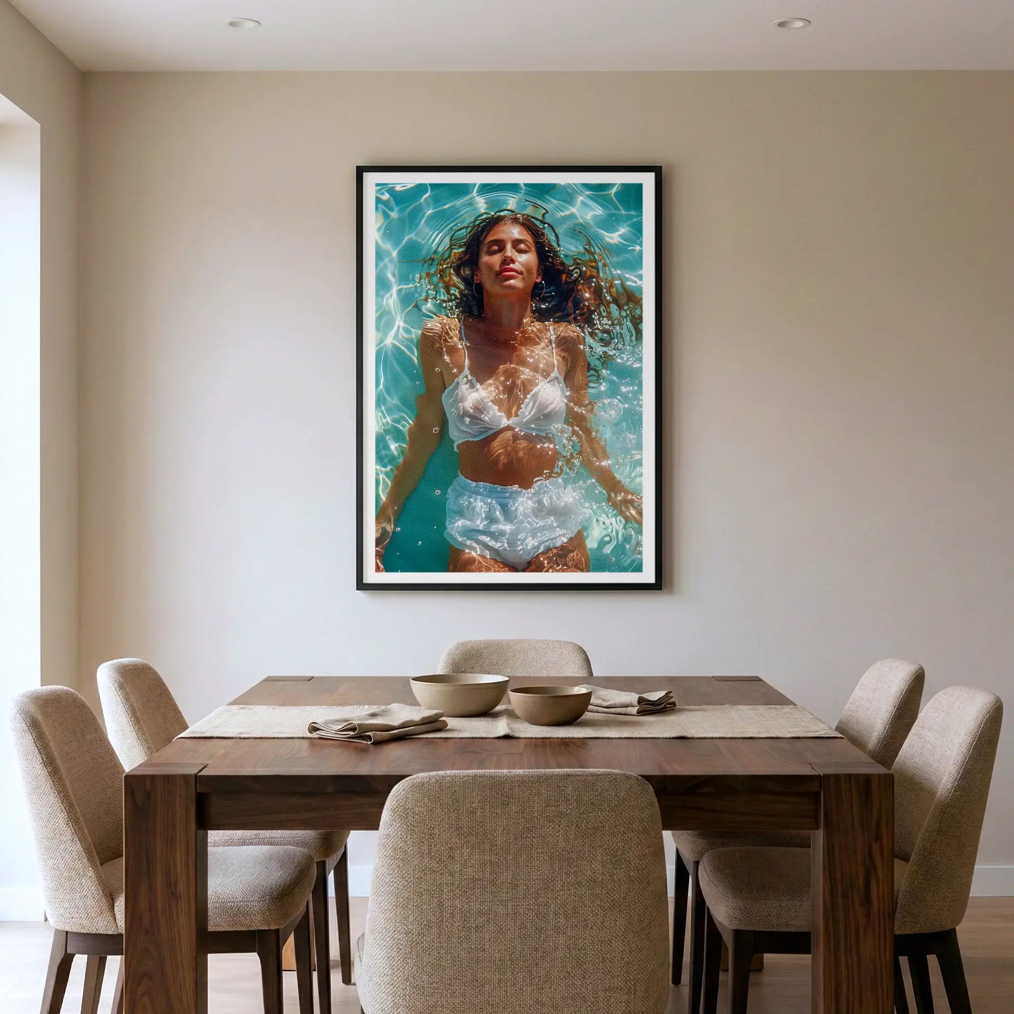 Framed summer art print with woman floating in a pool, titled Paradise displayed in dining room