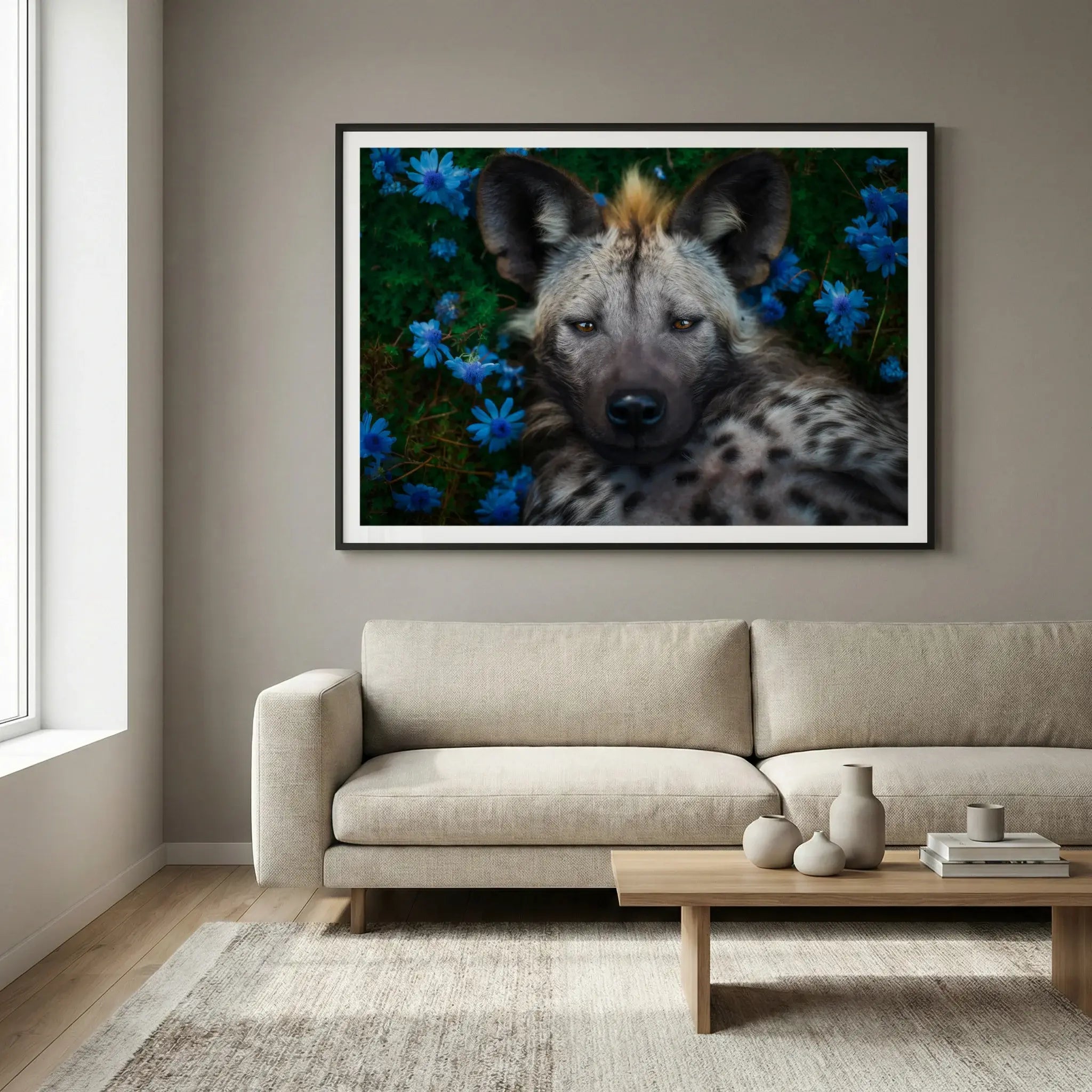 Framed wildlife art print with hyena and blue flowers, titled Peace displayed in living room