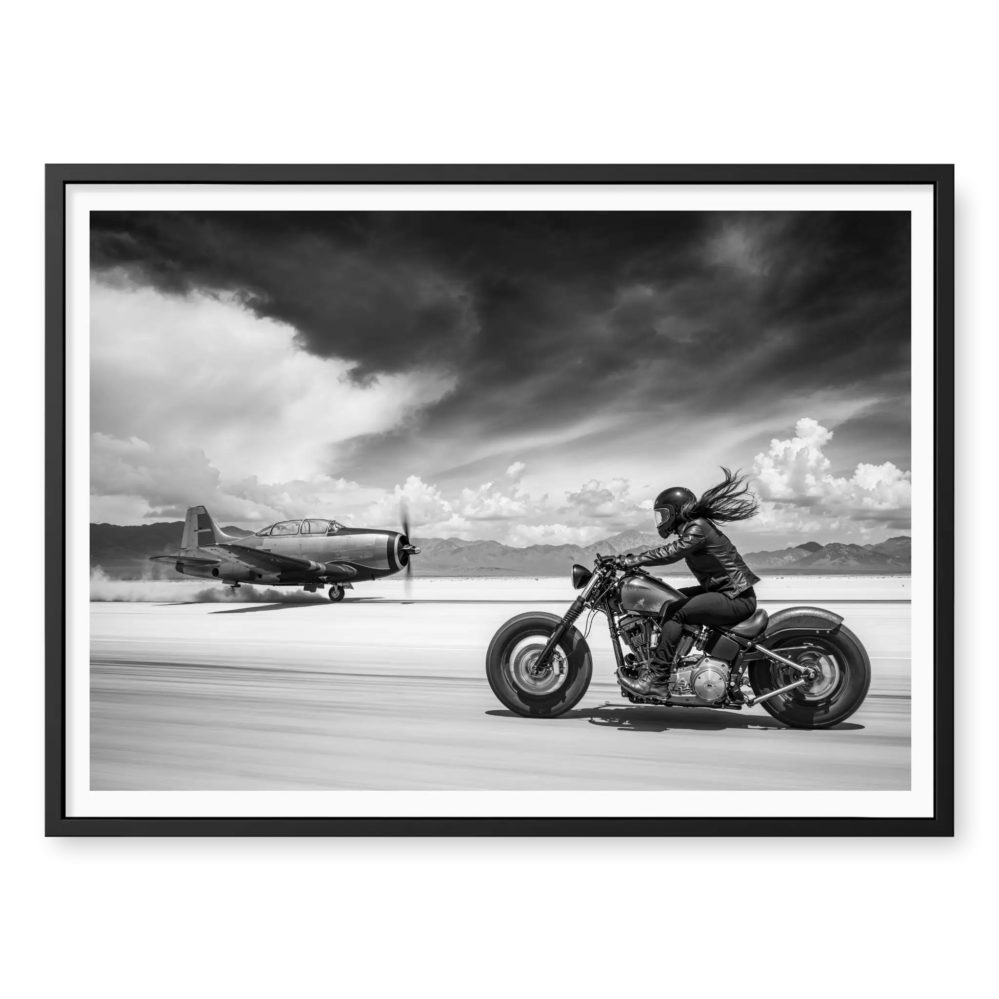 Side view of a rider on a motorcycle racing down a runway alongside a vintage propeller plane, black and white art print titled Ride or Die in black frame