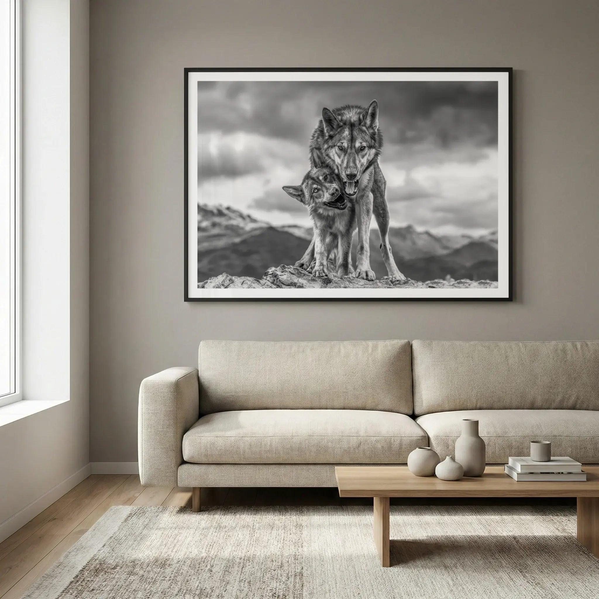 Framed wildlife art print with wolves on a mountain, titled Safe displayed in living room