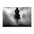 Silhouette of a cowboy riding a horse head-on through thick dust and fog, with a second rider fading into the background, black and white art print titled Searchers