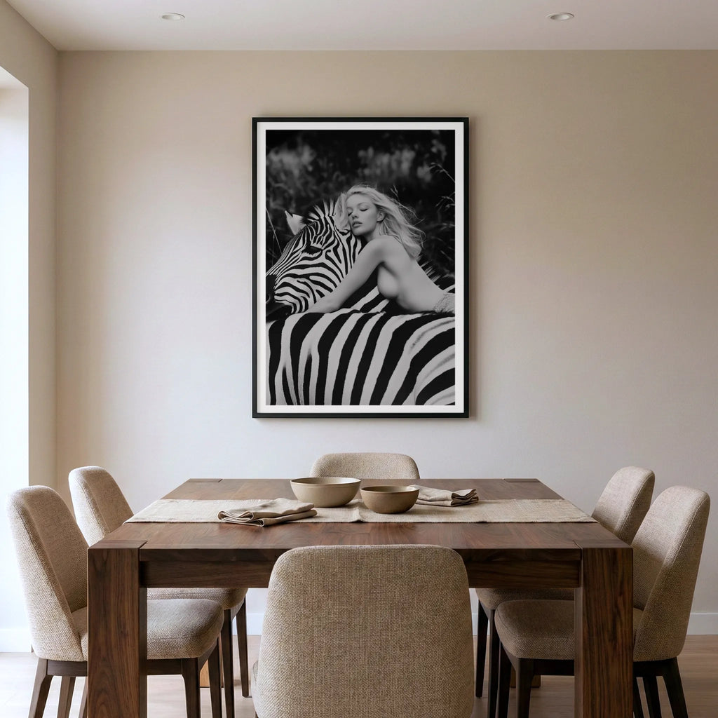 Framed black and white fine art print with woman and zebra, titled Stripes displayed in dining room