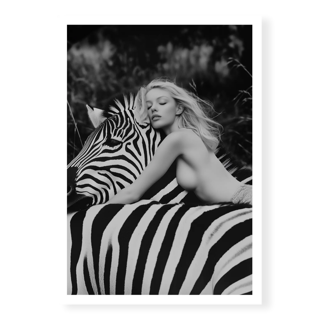 Close-up black and white fine art print of a blonde woman leaning forward with her head resting gently on the neck of a zebra, titled Stripes