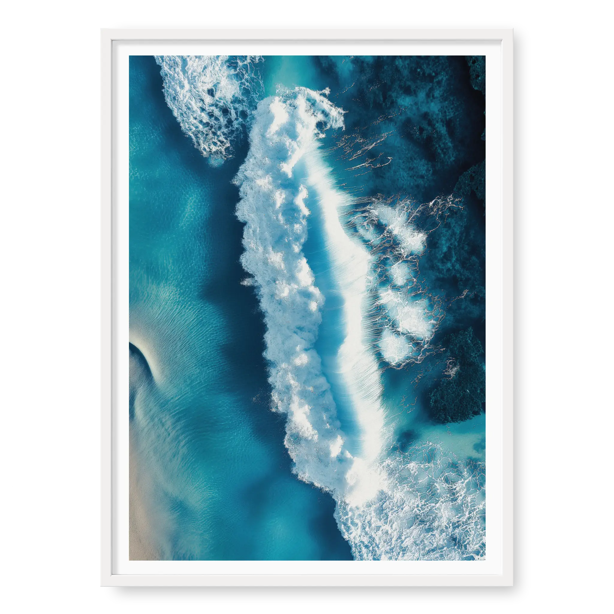 Aerial top-down view of a large white wave crashing in deep blue and turquoise ocean water with visible foam texture, art print titled Terra Mater in white frame