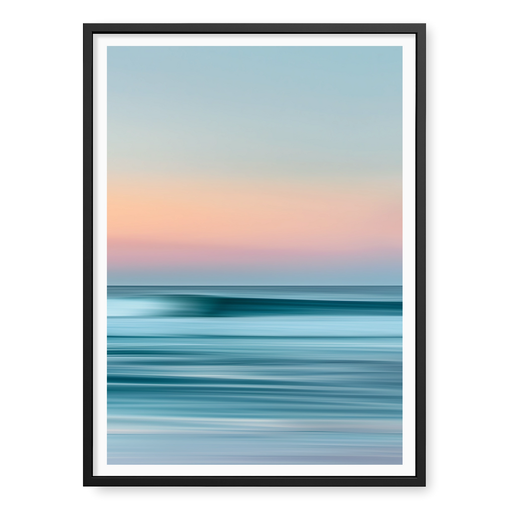 Abstract long-exposure seascape with blurred horizontal lines of teal water and pink sunset sky, art print titled Utopia in black frame
