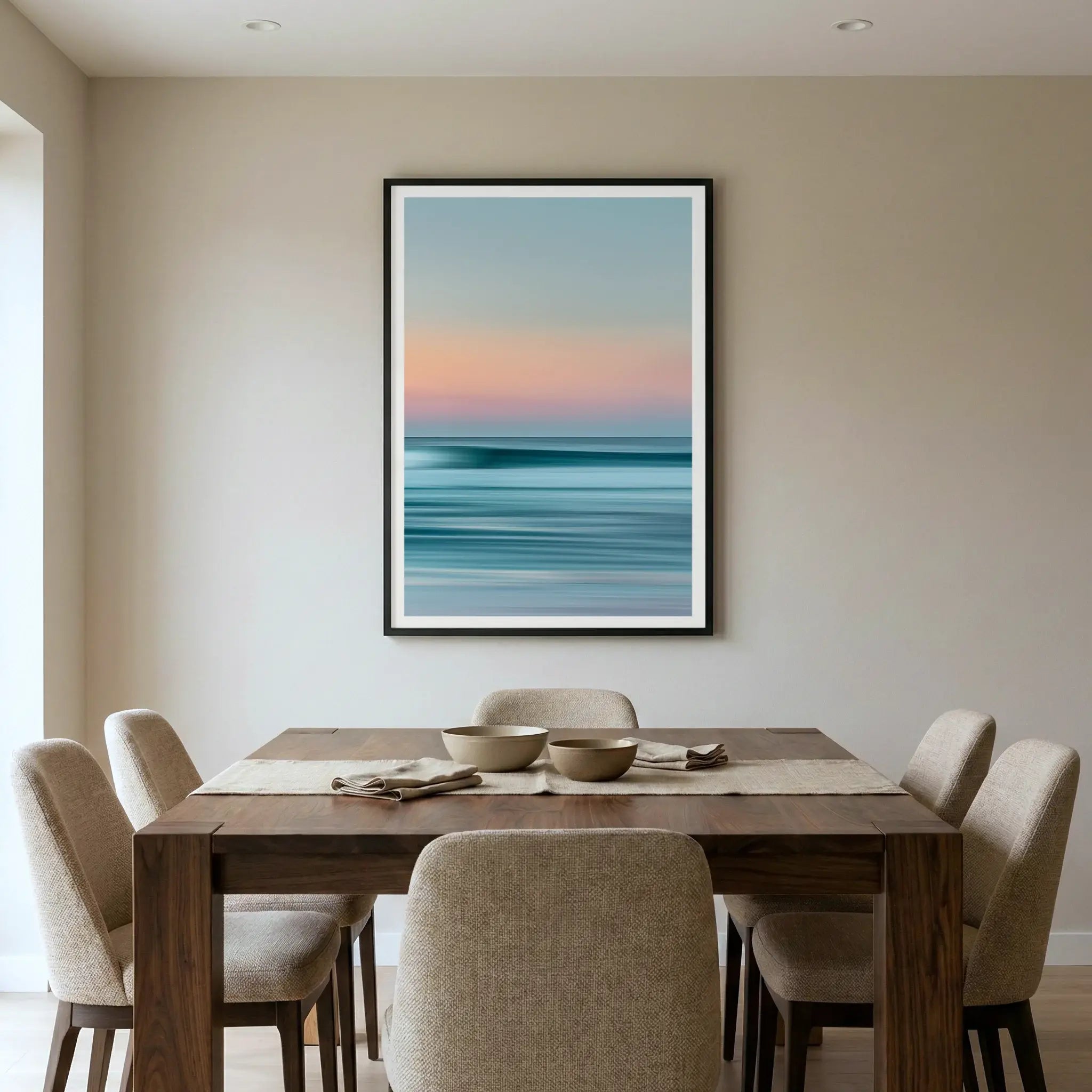 Framed abstract coastal art print with blurred horizon, titled Utopia displayed in dining room