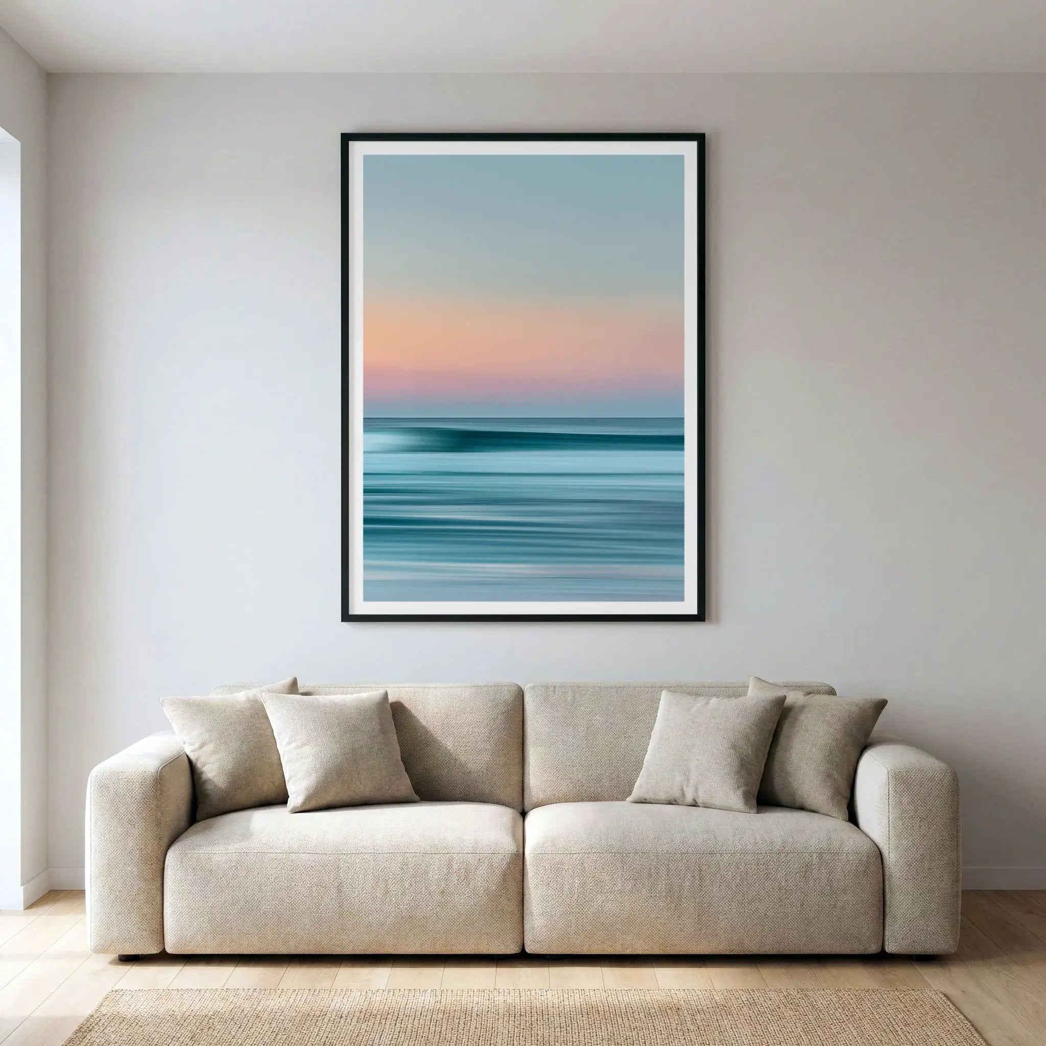 Framed abstract coastal art print with blurred horizon, titled Utopia displayed in living room